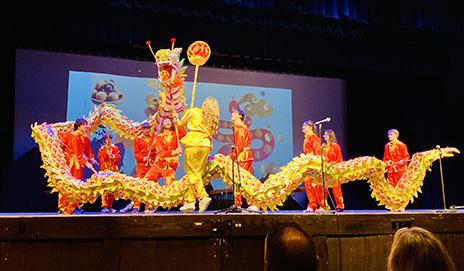 image of students dancing dragon dance